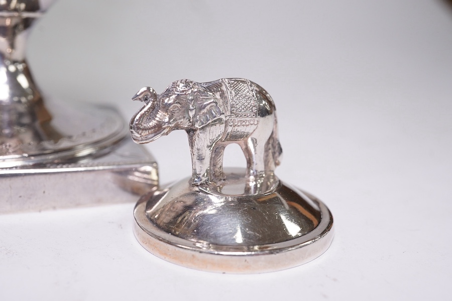 A George III silver helmet shaped cream jug by Peter & Ann Bateman, London, 1792, 14.4cm, together with two sterling menu holders. Condition - fair to good